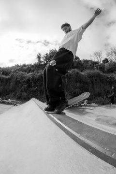 Flynn Acworth performing a hang-10 nose stall at Newtown D.I.Y. skate park in Wellington, New Zealand.
