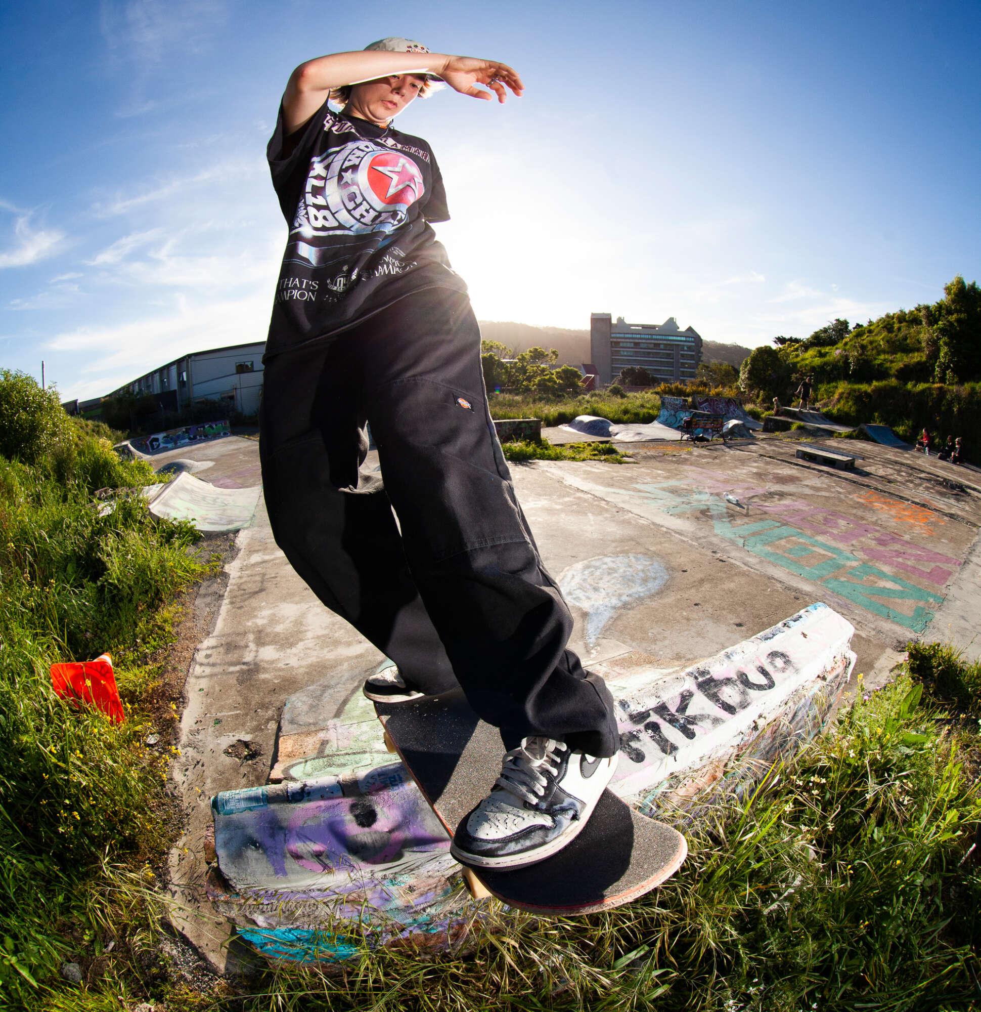Gala Baumfield performing a frontside rock n roll skateboard trick on a quarterpipe at Newtown, Wellington's Ghetto DIY Spot.