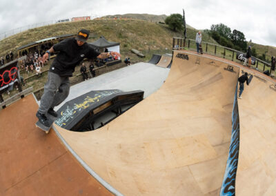 Chilla Corbs performs a feeble to fakie during DuckBrewe 5 at the Rolling Meadows music festival.