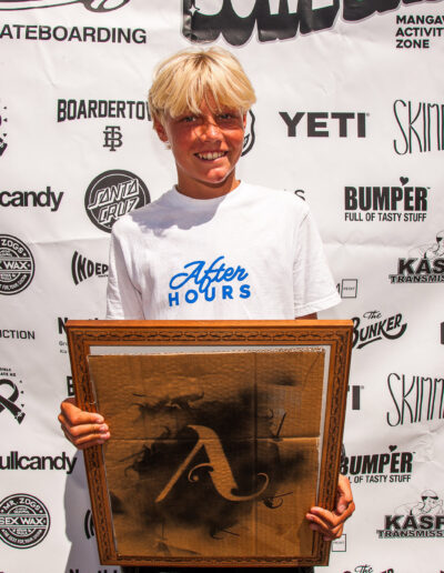 Monty Graham receiving his ‘Best Slam’ award from Armature Frames for his faceplant while trying a roll-in lipslide on the first run of the competition.