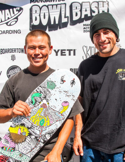 Eric Winkowski presenting Zedyn Fellows with a custom-coloured-in board as a additional prize for winning the best trick on the Yeti cooler — Cab’ boneless.